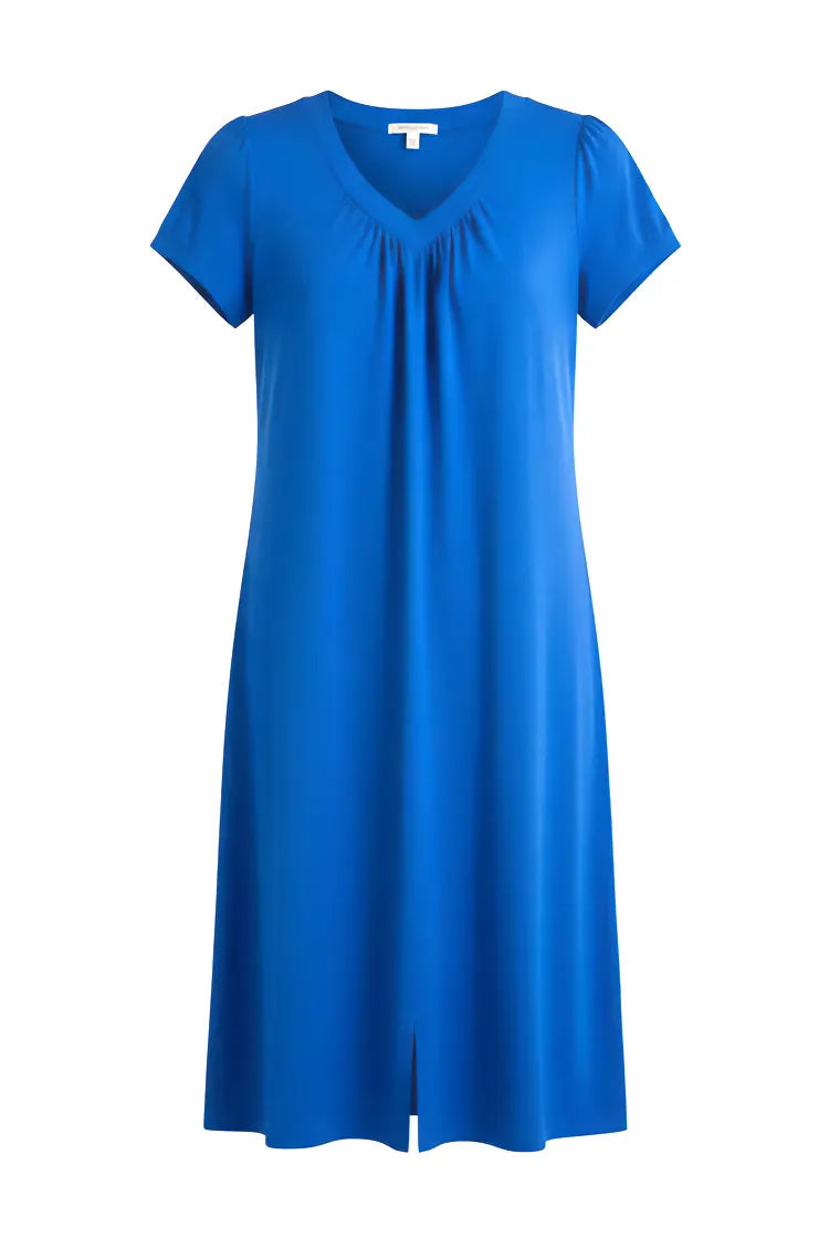 Mujer de espaldas con vestido corto de verano a topos multicolor manga corta