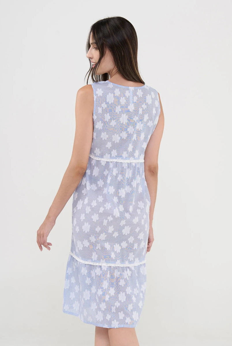 Vista trasera del vestido de playa corto sin mangas, dibujo flocado flores y puntilla