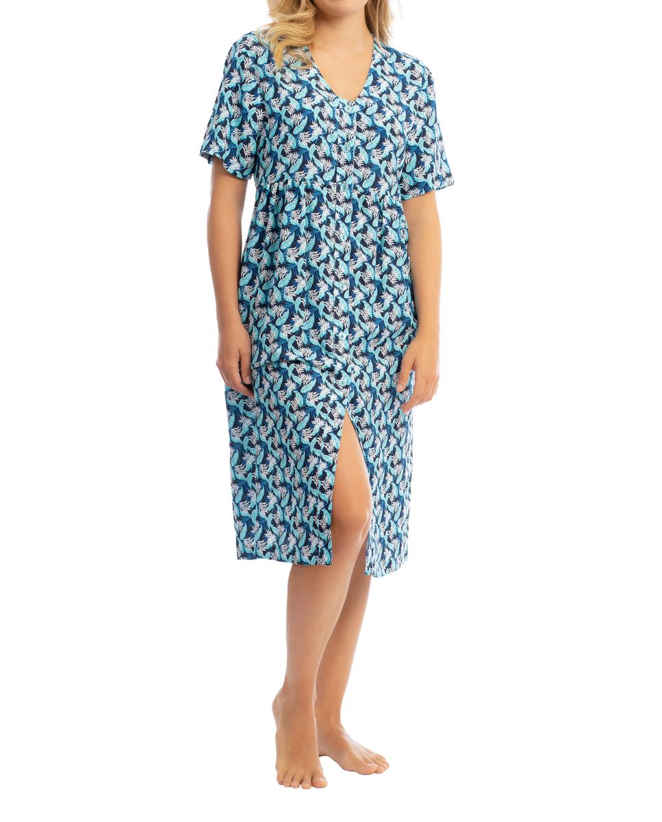 Woman in a summery tropical print dress perfect for a day at the beach