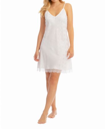 Woman in white satin summer nightdress with straps and lace