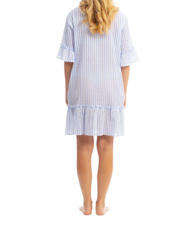 Rear view of a woman in a short cotton dress with blue vertical stripes.