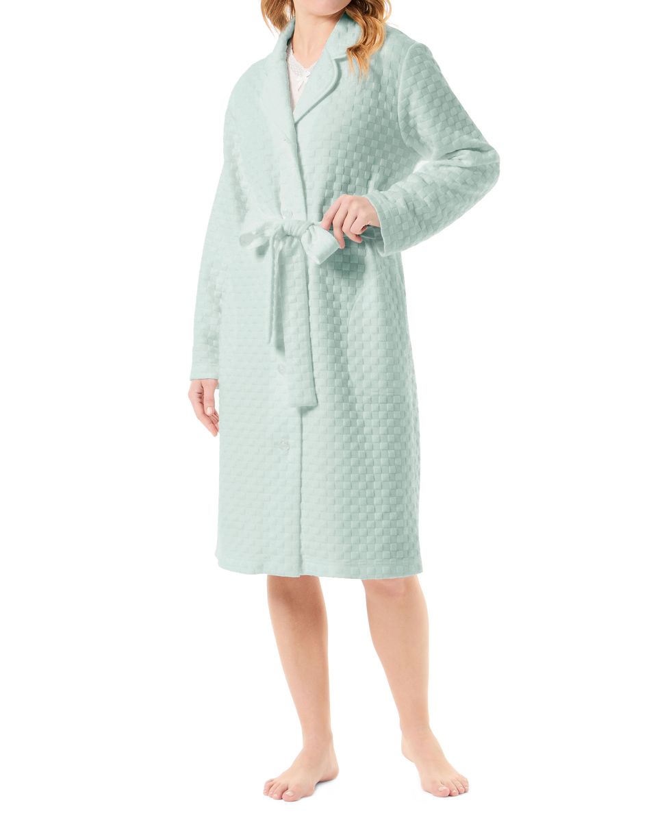 Woman in green open long dressing gown with circular knitted buttons