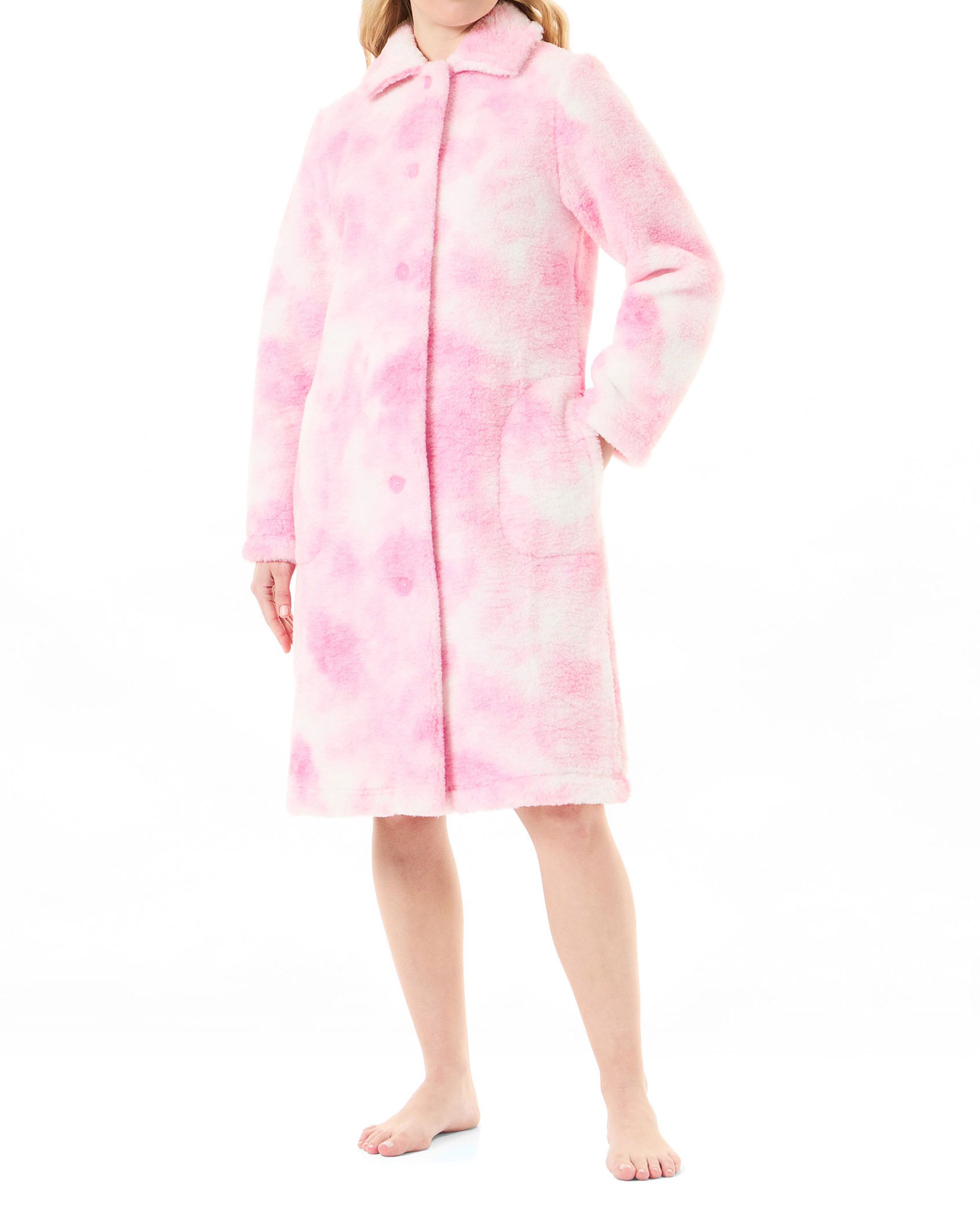 Woman in long-sleeved open pink sheepskin coat with long sleeves and side pockets