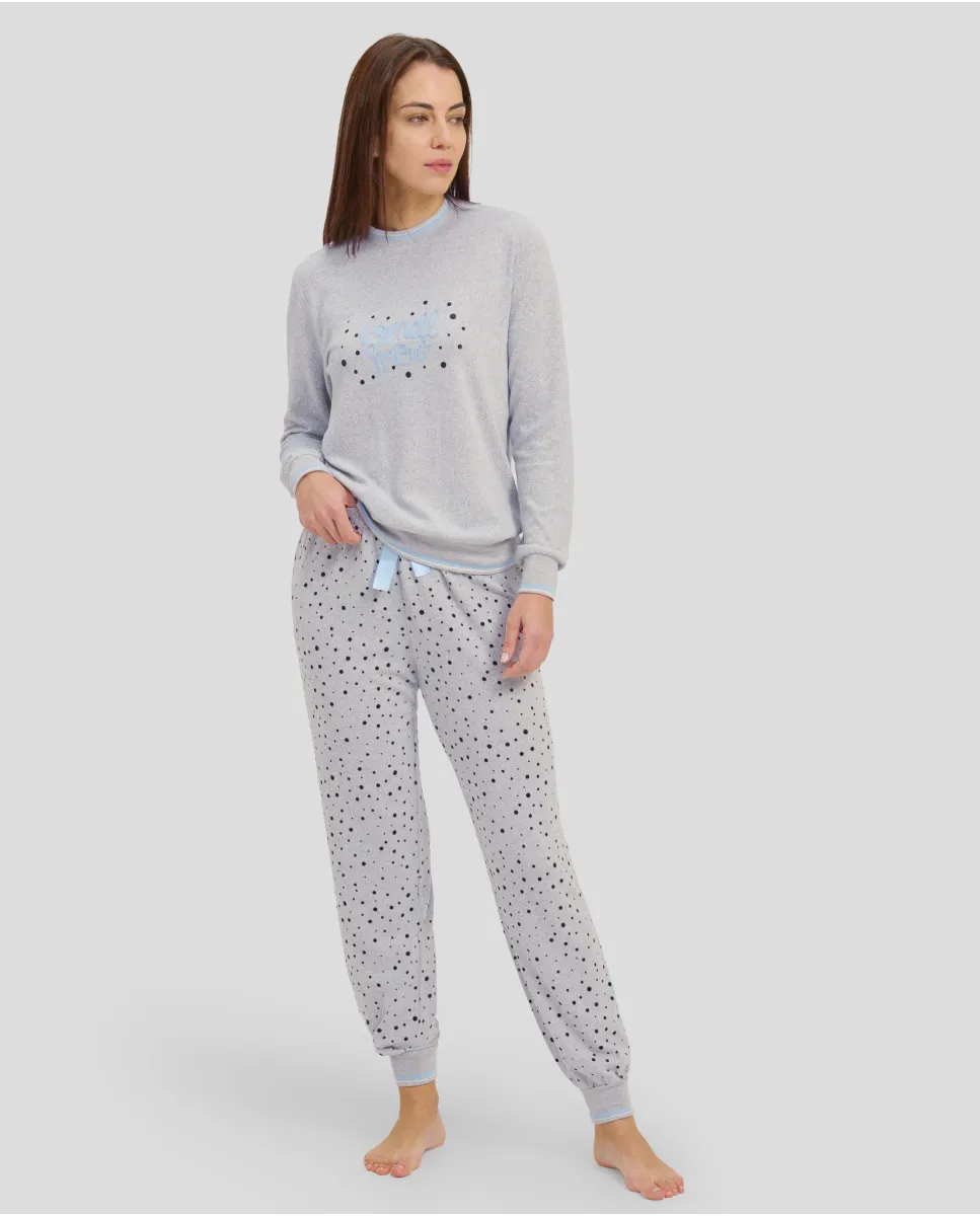 Woman in grey long winter pyjamas with closed collar and cuffs