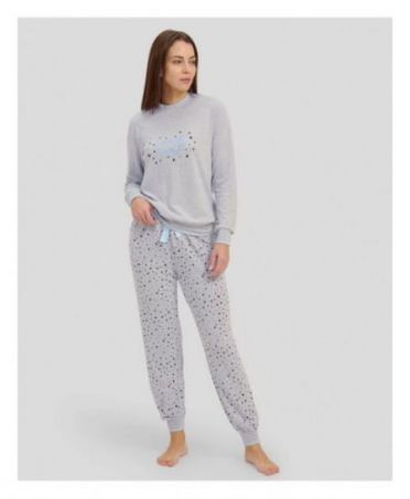 Woman in grey long winter pyjamas with closed collar and cuffs