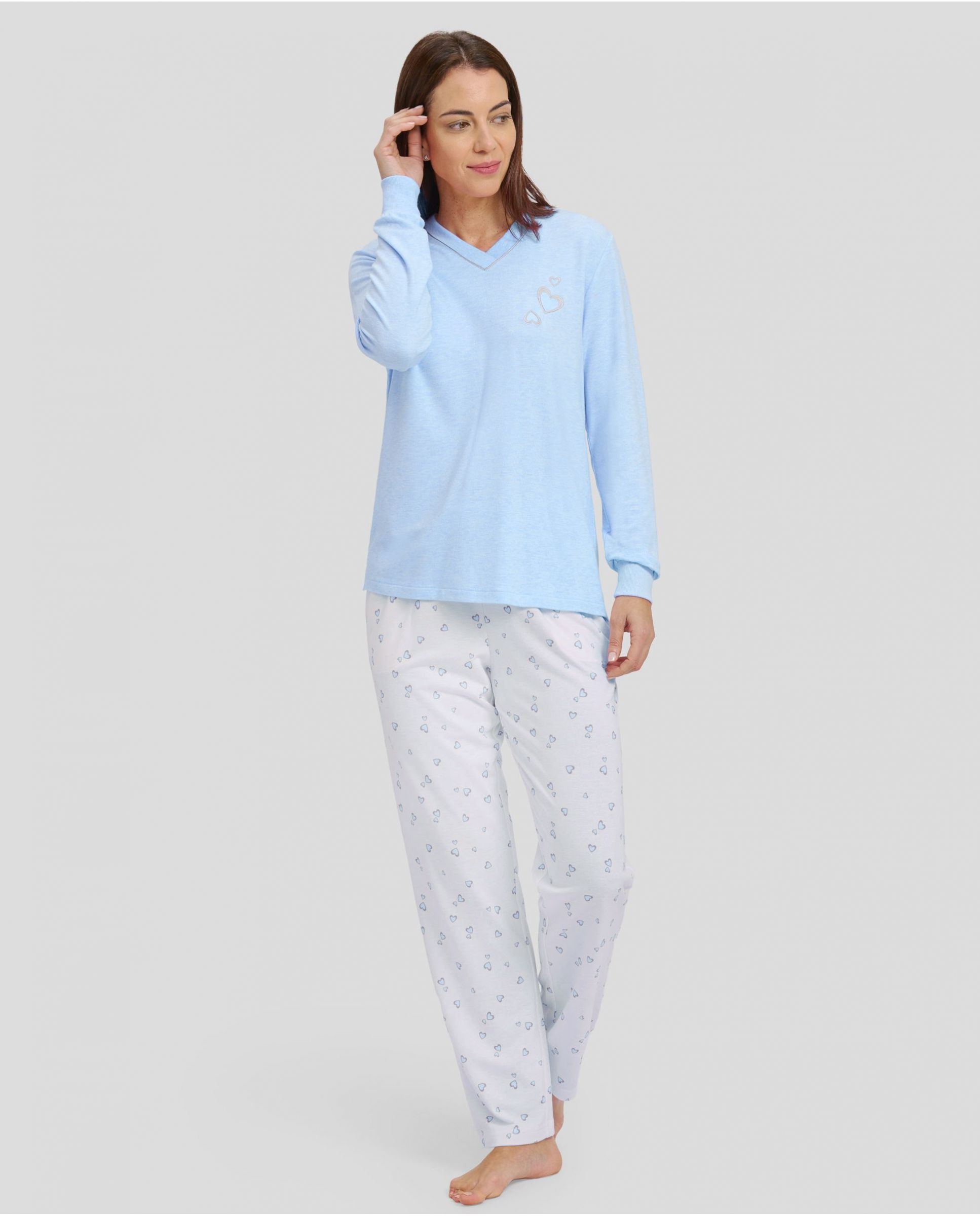 Women's pyjamas with light blue long sleeves with cuffs and v-neck and matching hearts long trousers