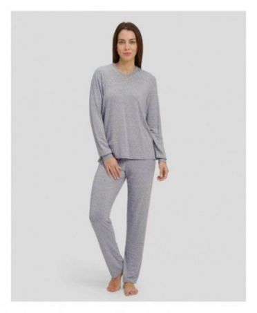 Woman in grey winter pyjamas with diamond pattern with cuffs and V-neck collar