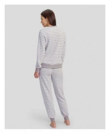 Rear view of a woman in grey striped pyjamas with pockets and cuffs for winter.