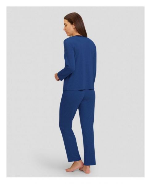 Rear view of woman in navy blue plain modal pyjamas for winter