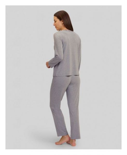 Rear view of woman in plain modal grey pyjamas for winter