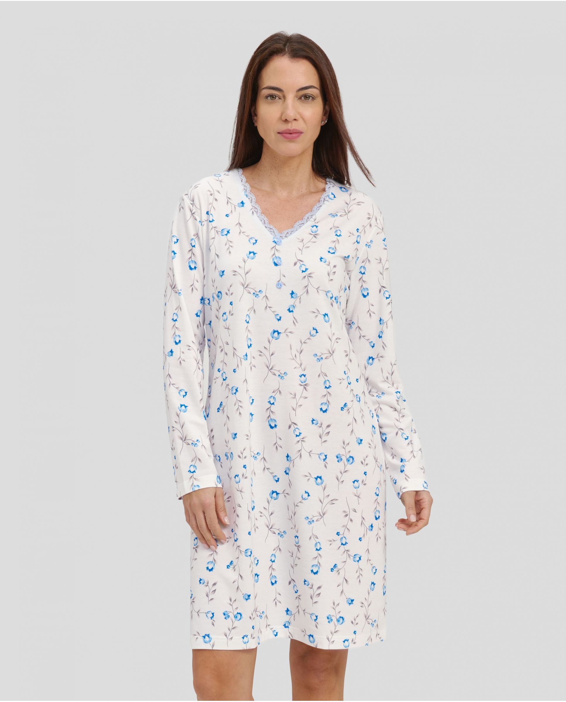 Woman with light blue flowered winter nightdress with lace collar