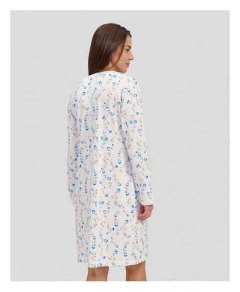 Rear view of a woman wearing a light blue flowered nightgown for winter