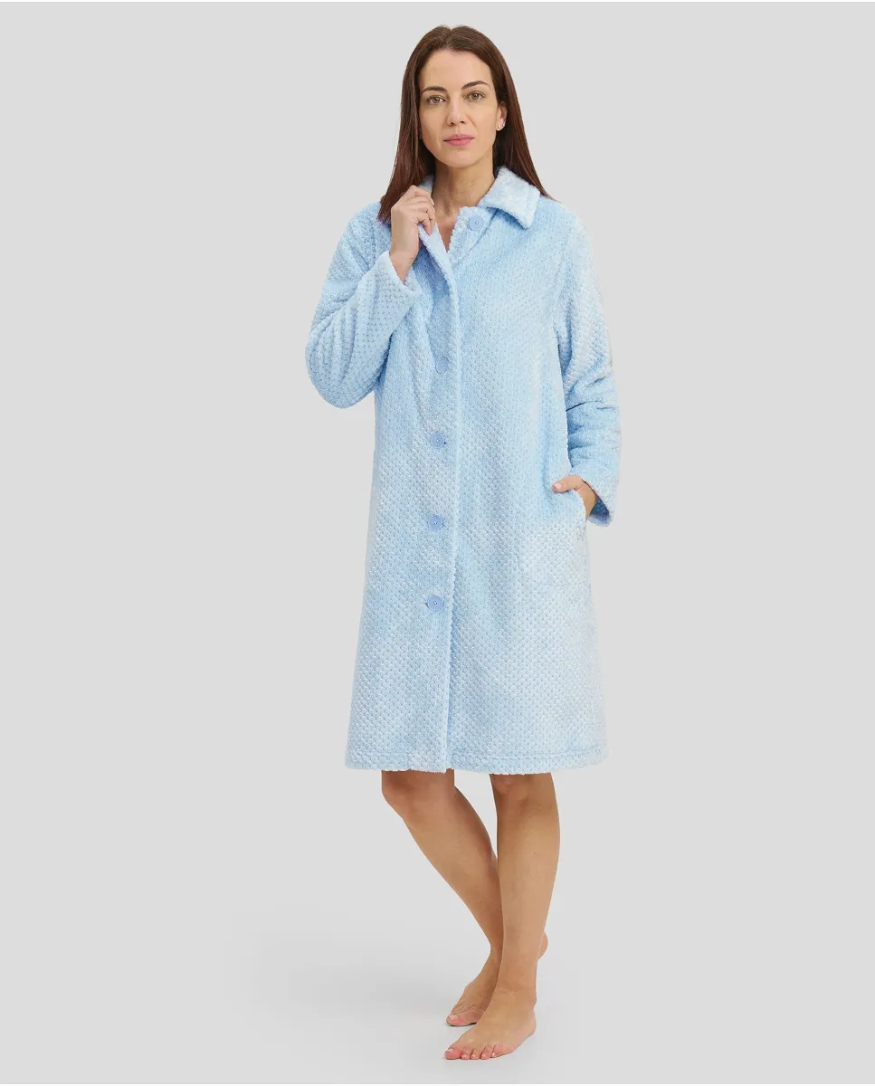 Woman with open long dressing gown with buttons and light blue side pockets