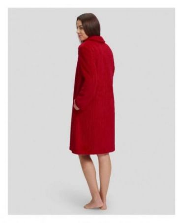 Rear view of woman in long red winter dressing gown with pockets