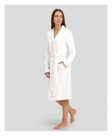 Woman in ivory winter long dressing gown with lapel collar, belt and long sleeves