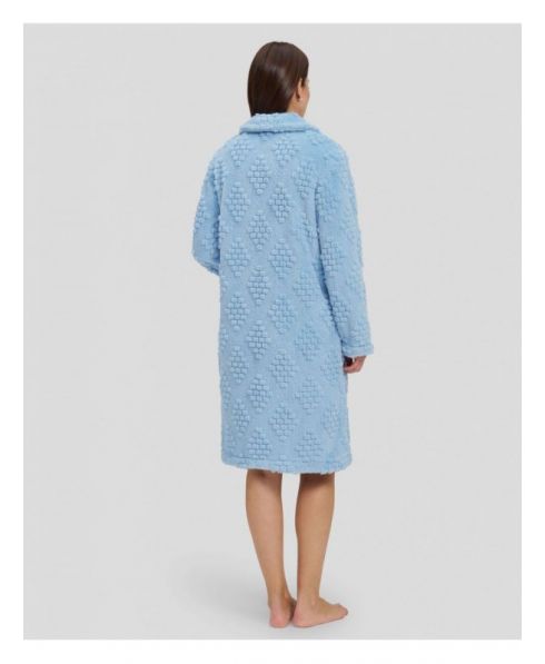 Rear view of woman in light blue jacquard woven winter coat