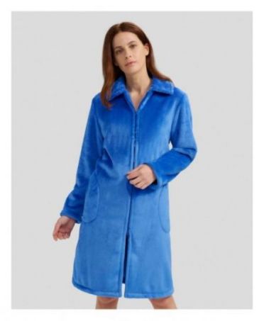 Woman in long blue winter dressing gown with zip and pockets