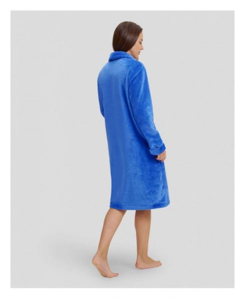 Woman in long blue winter dressing gown with side pockets