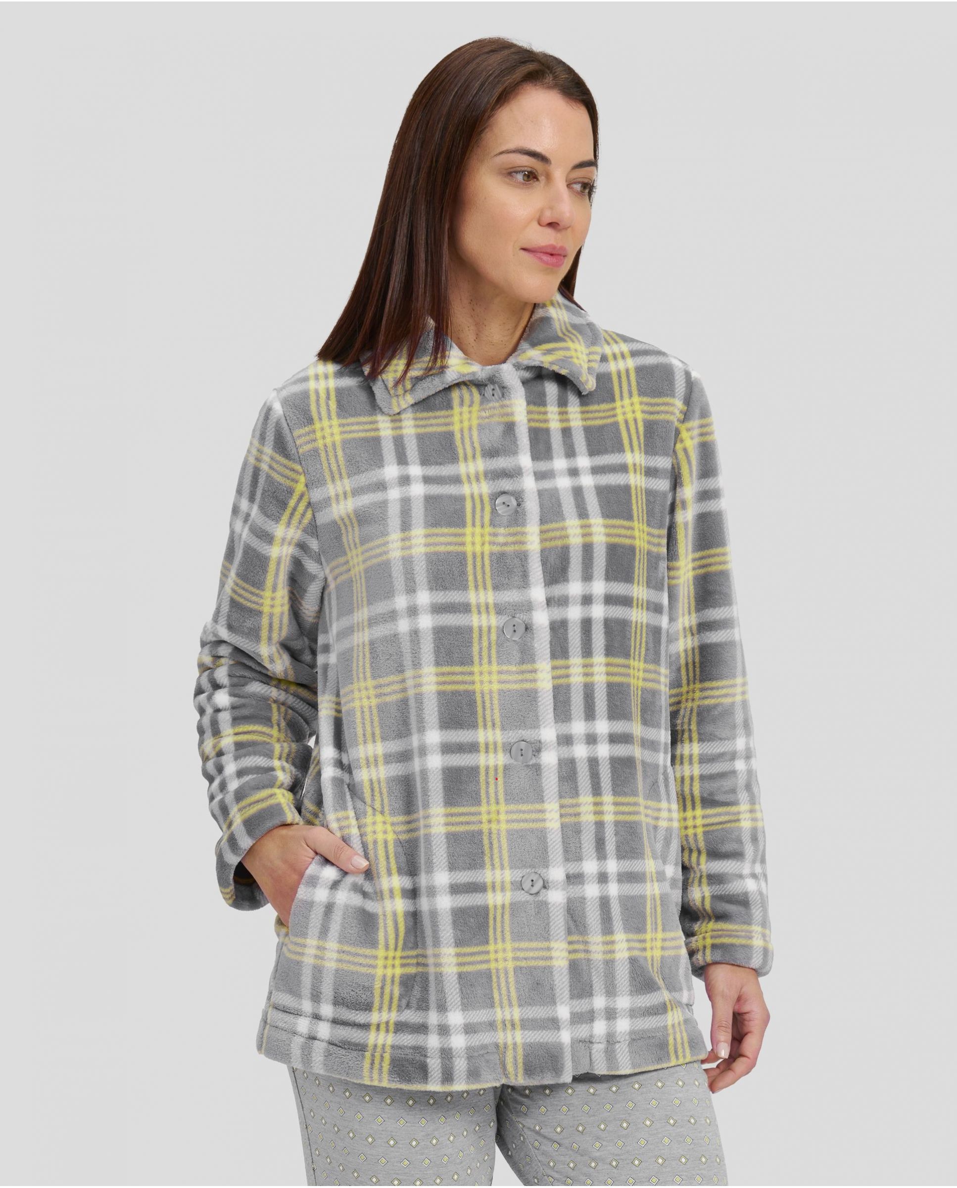 Woman in short plaid buttoned winter dressing gown