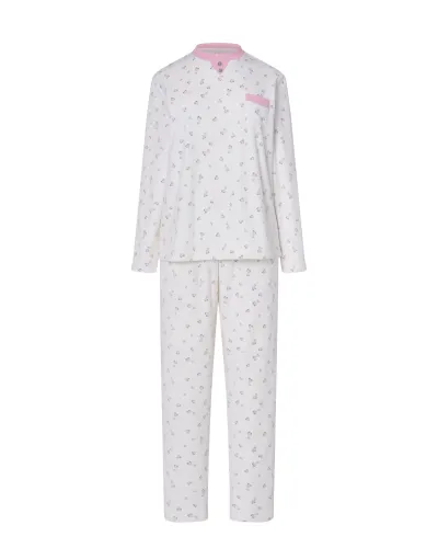Woman in ivory winter pyjamas with pink hearts and detailing on collar, pocket and cuffs