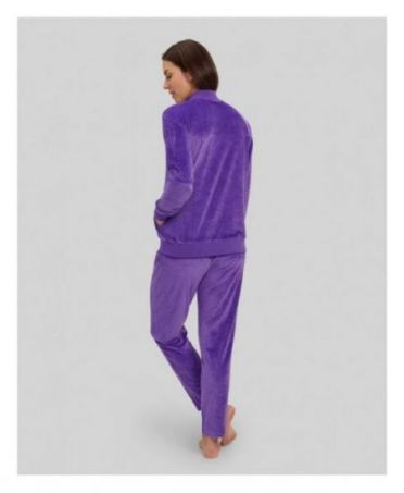 Rear view of woman in purple jacquard velvet tracksuit