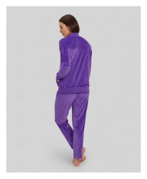 Rear view of woman in purple jacquard velvet tracksuit