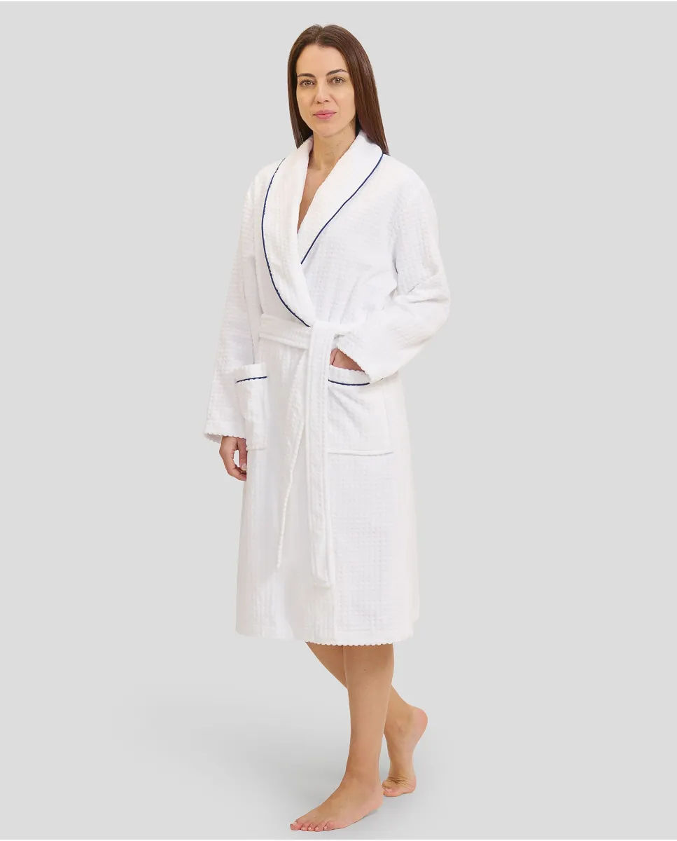 Woman in long white crossover bathrobe with piping and pockets