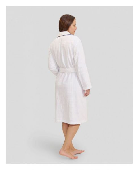 Rear view of woman in white dressing gown