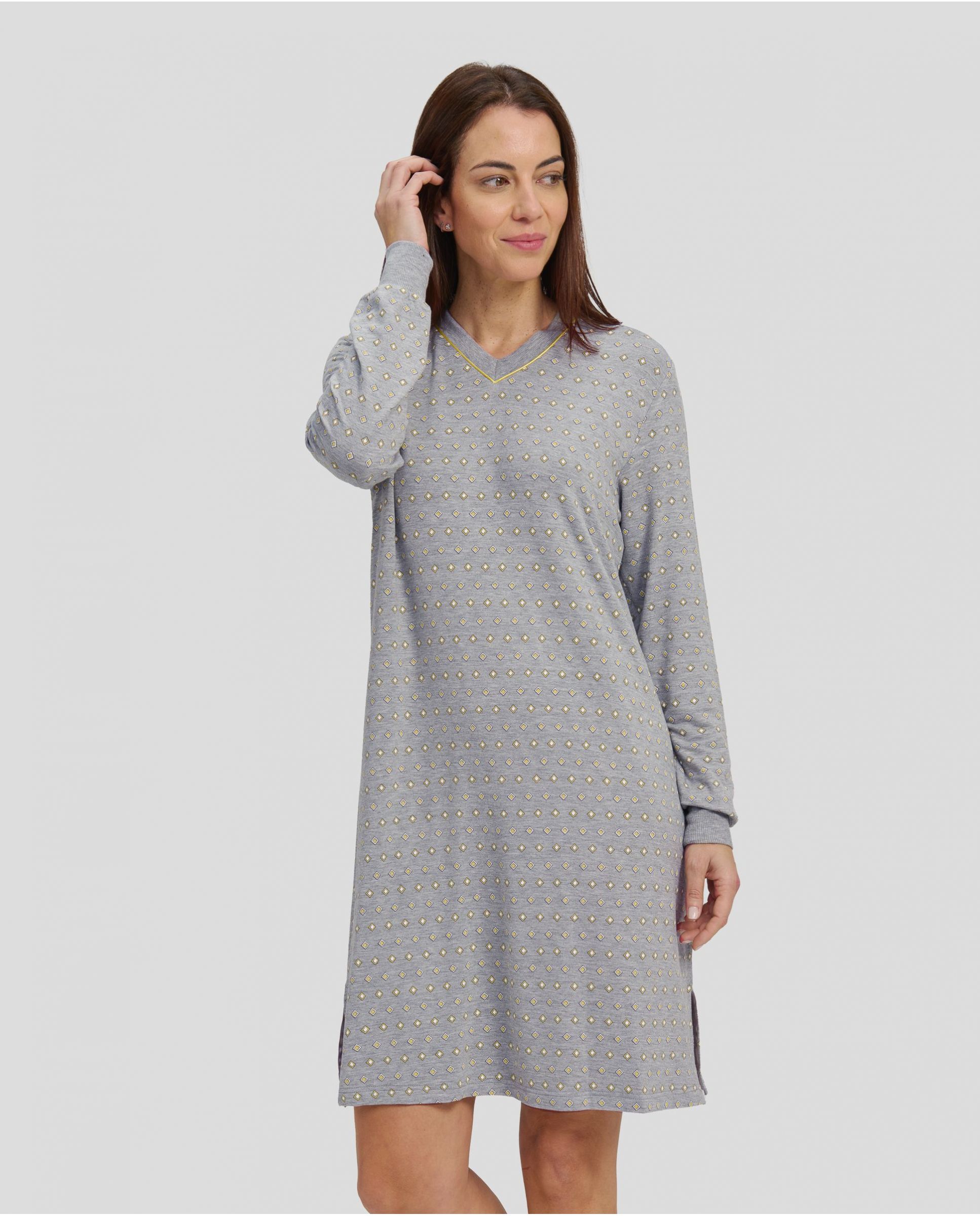 Woman with long-sleeved winter nightgown in grey with yellow diamond print