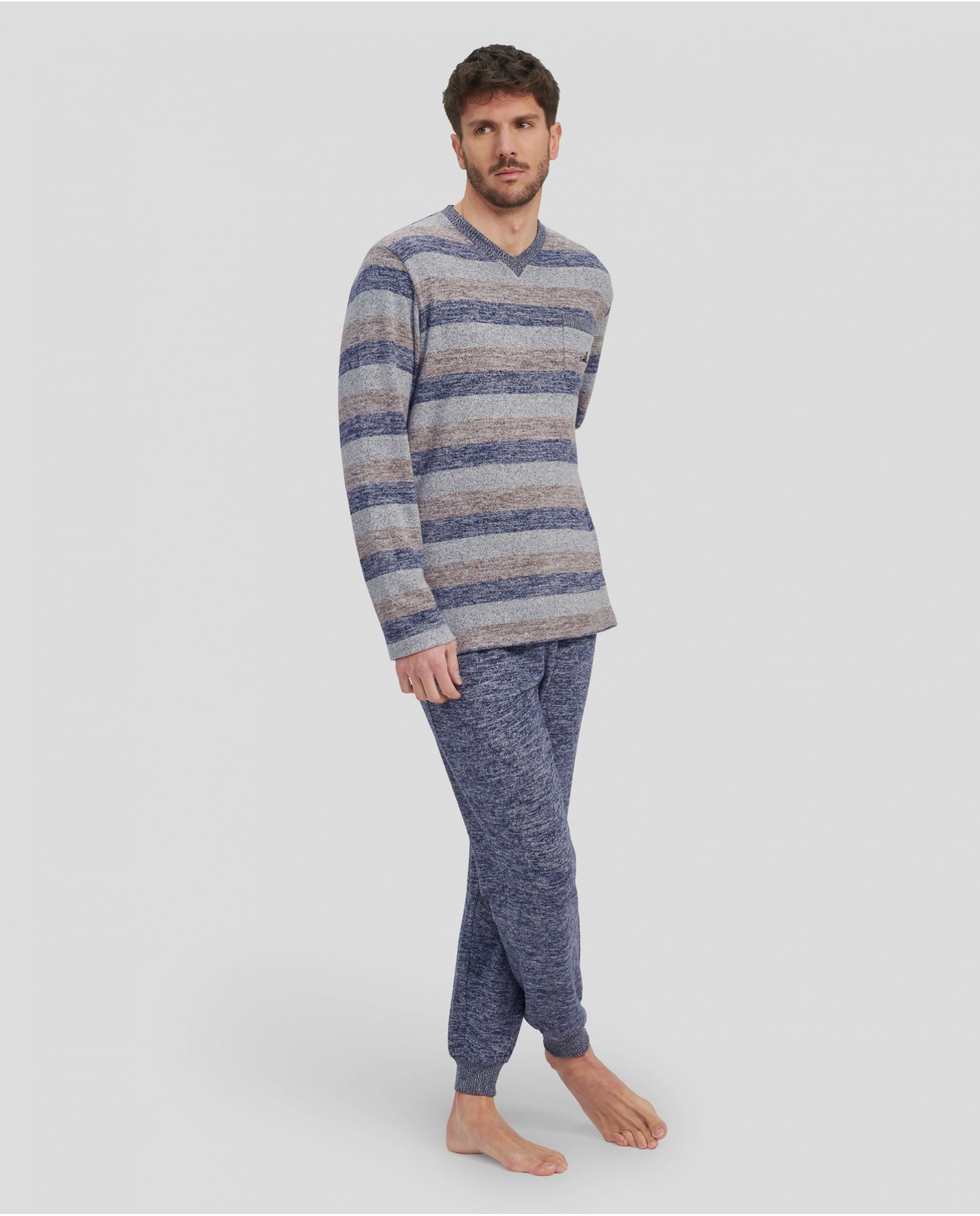 Man in grey striped winter pyjamas with V-neck collar