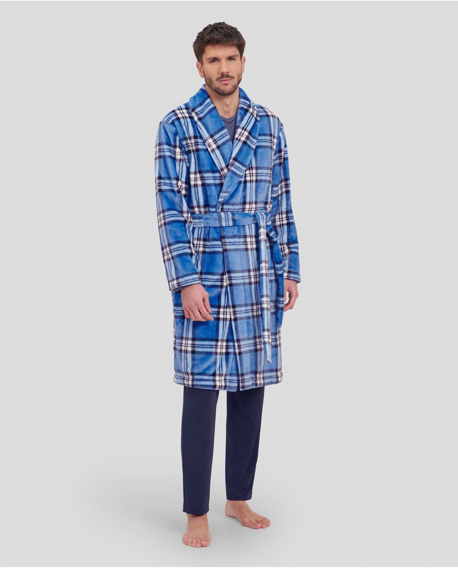 Man in a long, cross checkered winter dressing gown with pockets