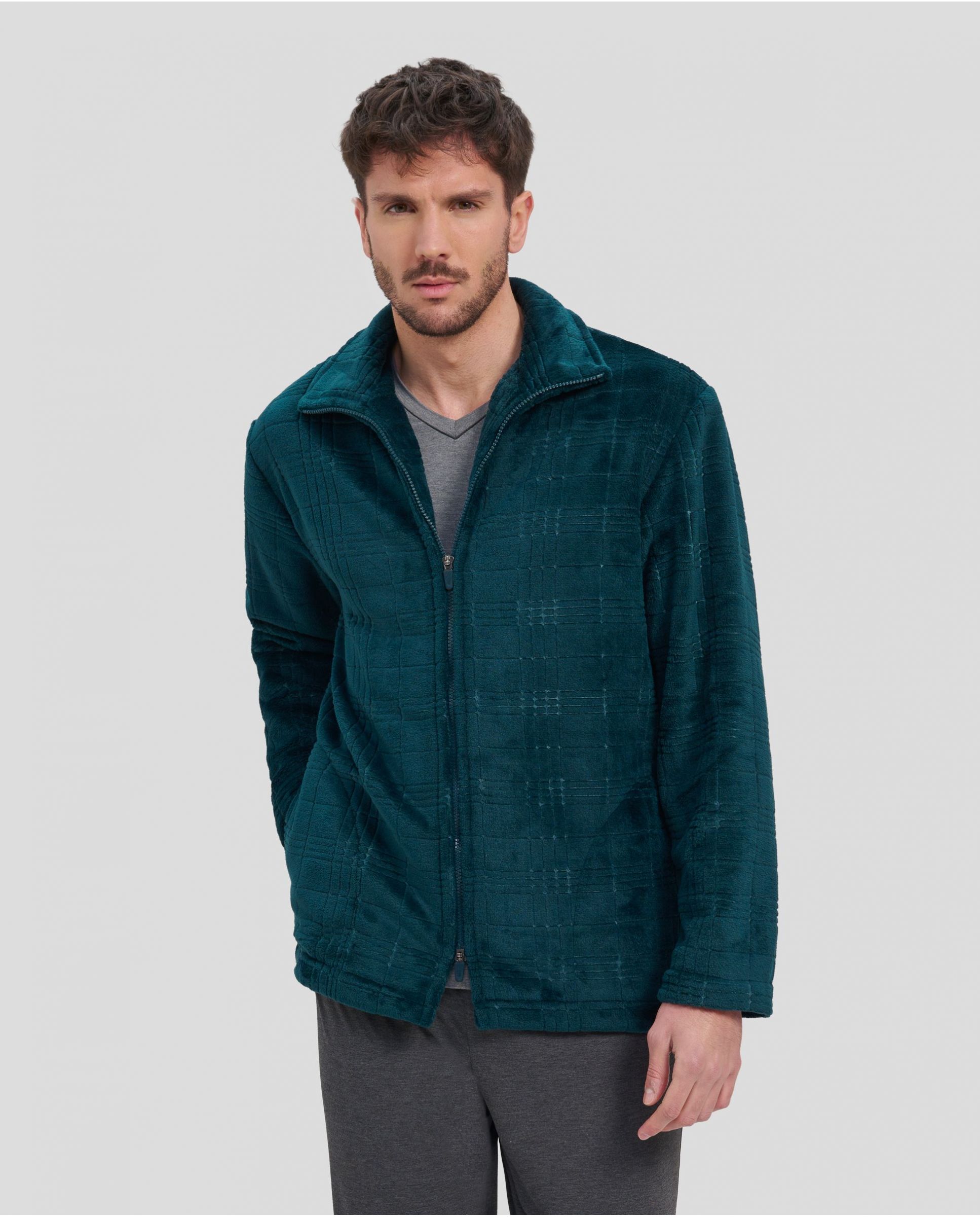 Man in green checked short winter coat with zip and side pockets