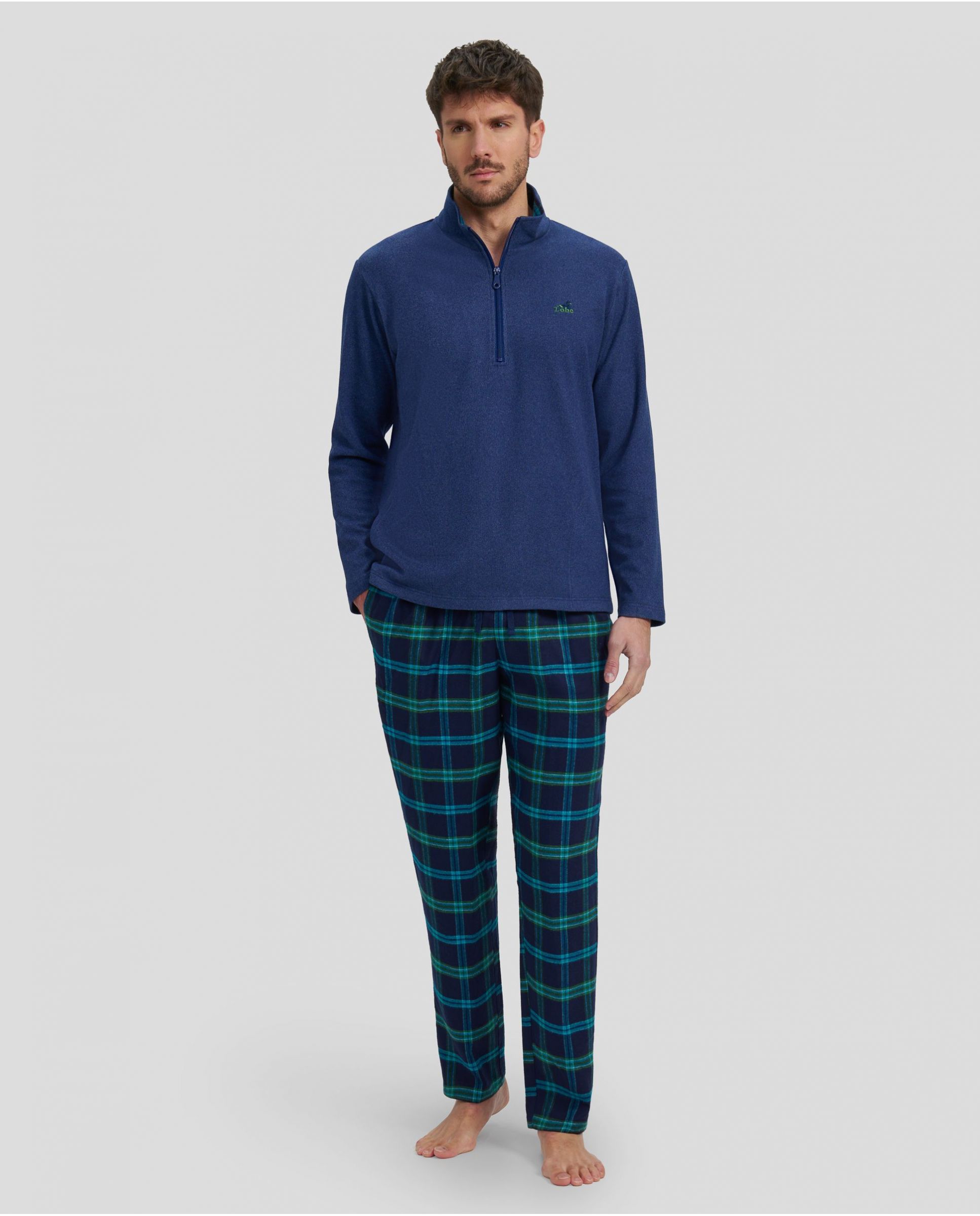 Man in winter pyjamas with blue plain jacket and green checkered trousers