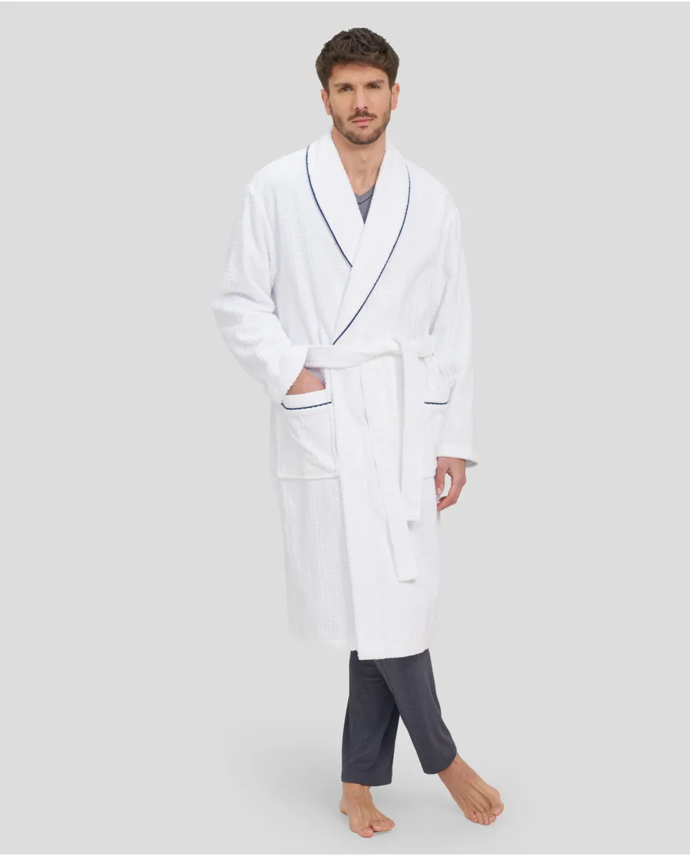 Man in white bathrobe with dinner jacket collar and blue piping and pockets