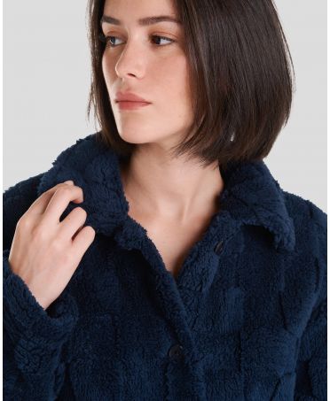 Collar detail view of women's winter coat in navy jacquard checkered jacquard.