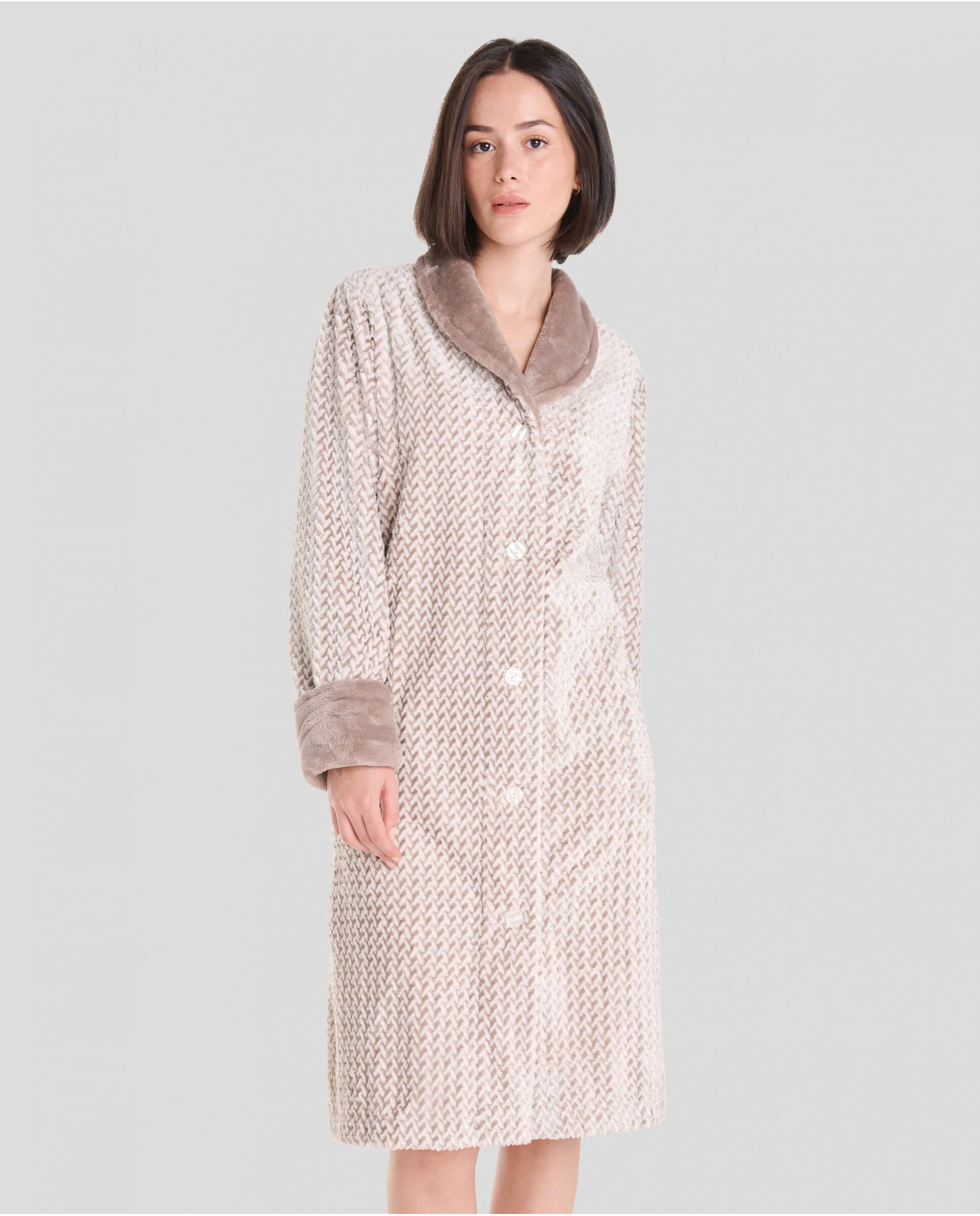 Woman in jacquard long coat with grey herringbone pattern