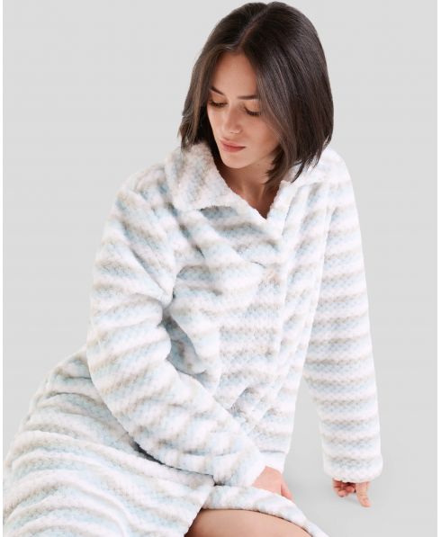 Woman in warm and comfortable striped jacquard winter dressing gown