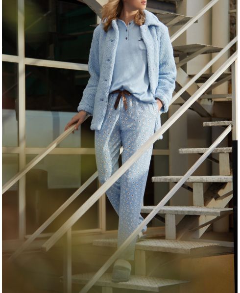 Woman in light blue short coat with sheepskin and pockets