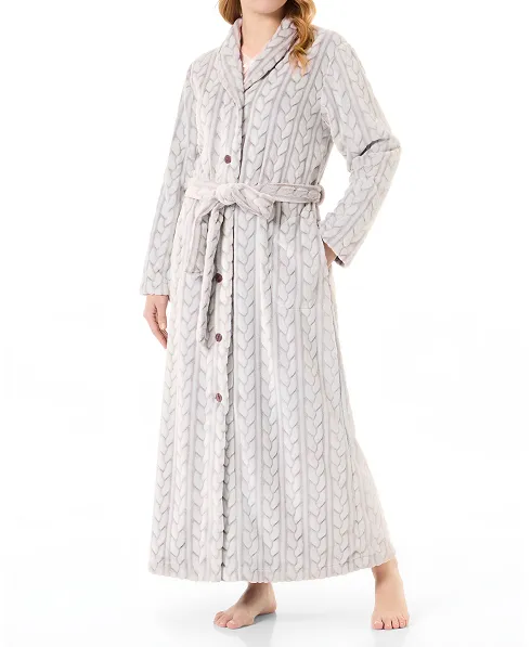 Woman in long brown braid woven dressing gown, open with buttons, belt and side pockets.