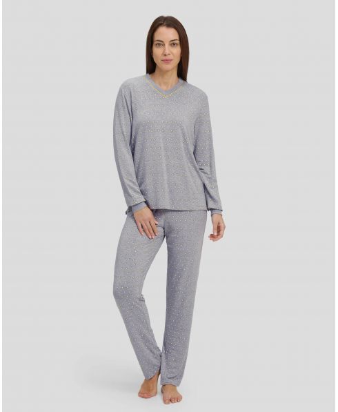 Woman in grey winter pyjamas with diamond pattern with cuffs and V-neck collar