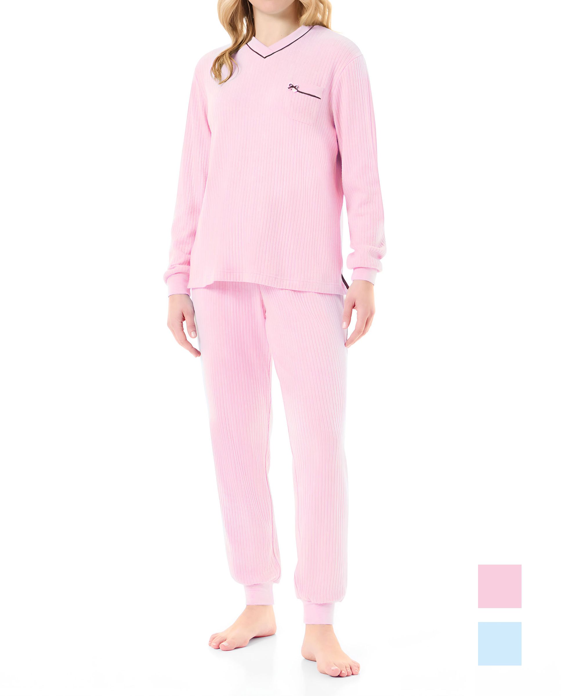 Woman in pink ribbed long pyjamas with long-sleeved jacket and plain cuffs and trousers