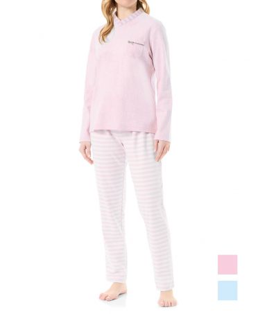 Woman wearing long pyjamas with a pink V-necked jacket, soft vigoré fabric and subtle striped details.