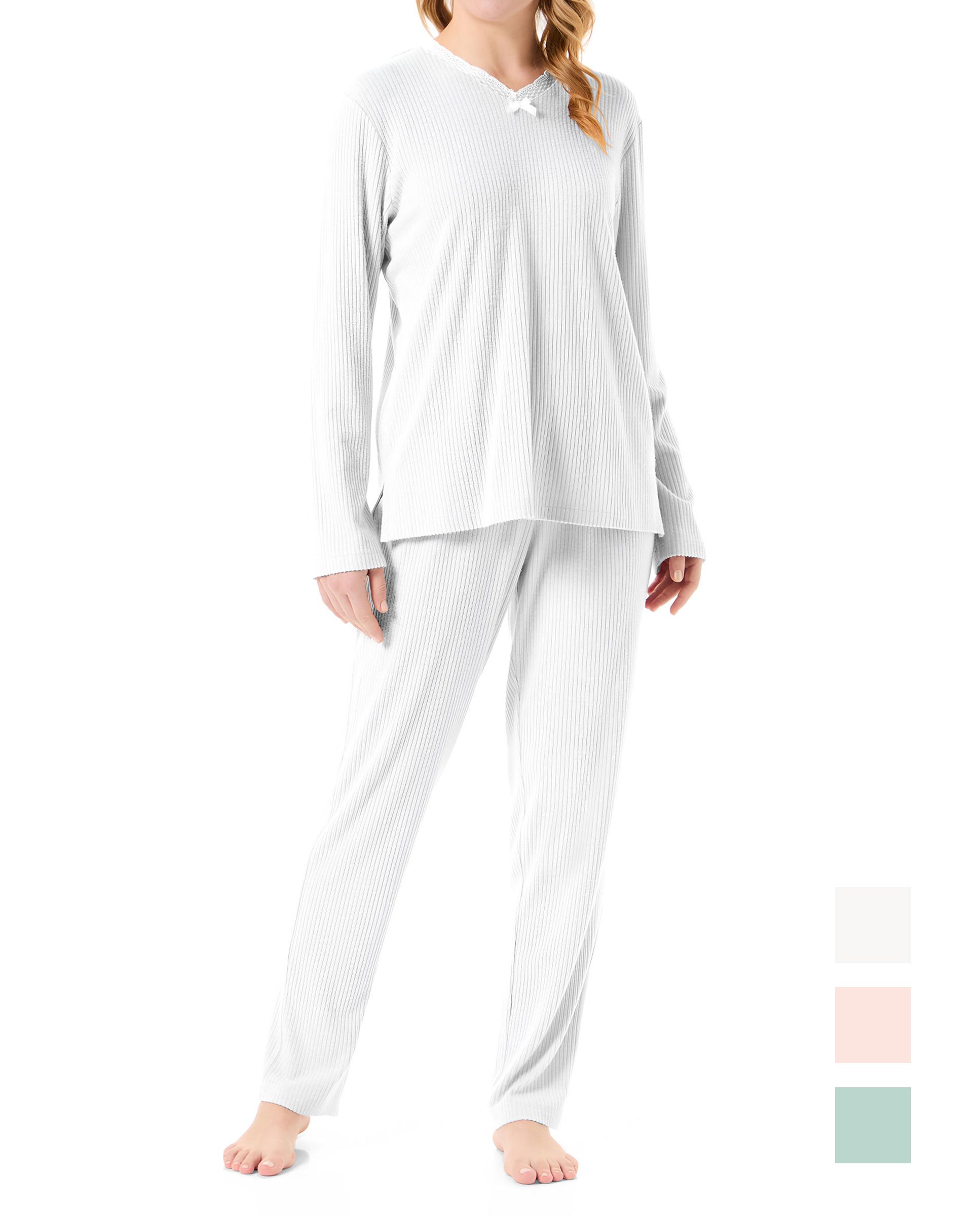 Woman in ivory long-sleeved lingerie pyjamas with lace details