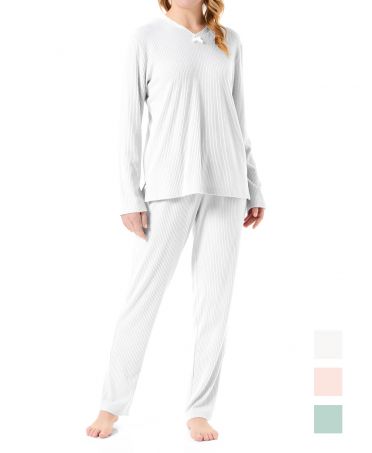 Woman in ivory long-sleeved lingerie pyjamas with lace details