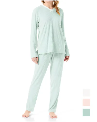 Woman in lingerie pyjamas with long sleeves in soft green with lace detail
