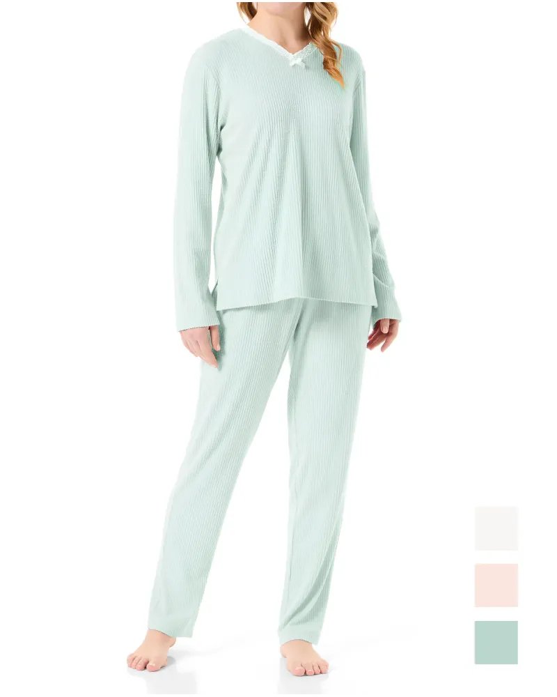 Woman in lingerie pyjamas with long sleeves in soft green with lace detail