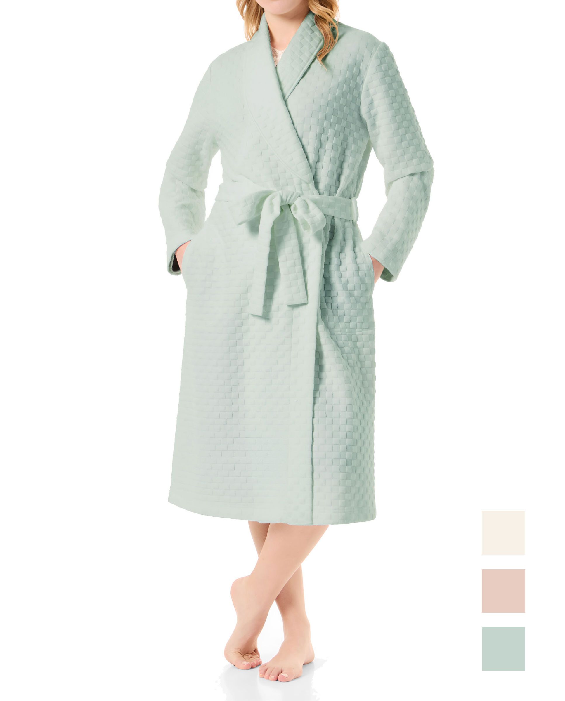 Woman in a long green circular knitted tuxedo-style dressing gown