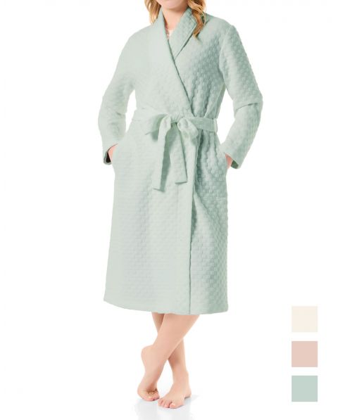 Woman in a long green circular knitted tuxedo-style dressing gown