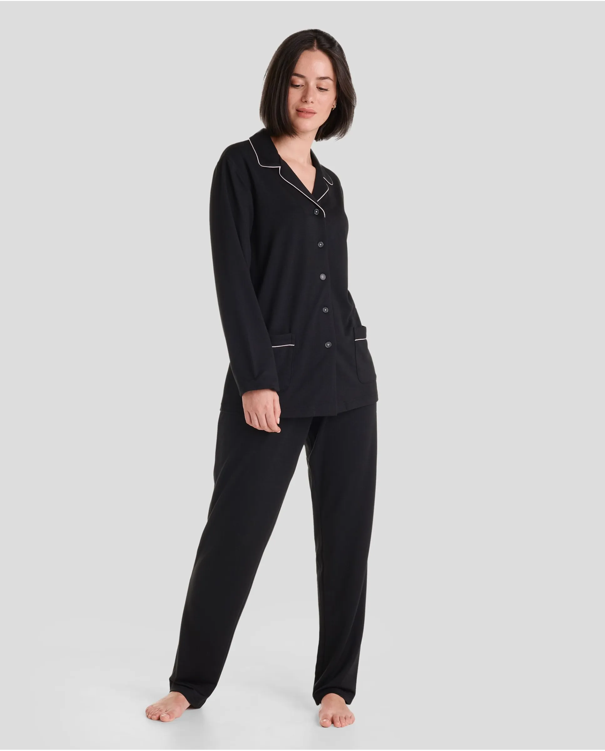 Woman with long black shirt pyjamas with piping