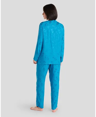 Rear view of a woman in blue jacquard pyjama bottoms